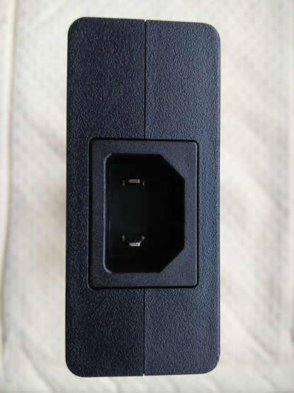 Close-up of input port on Sony ACDP-240E01 adapter for 100-240V AC input.