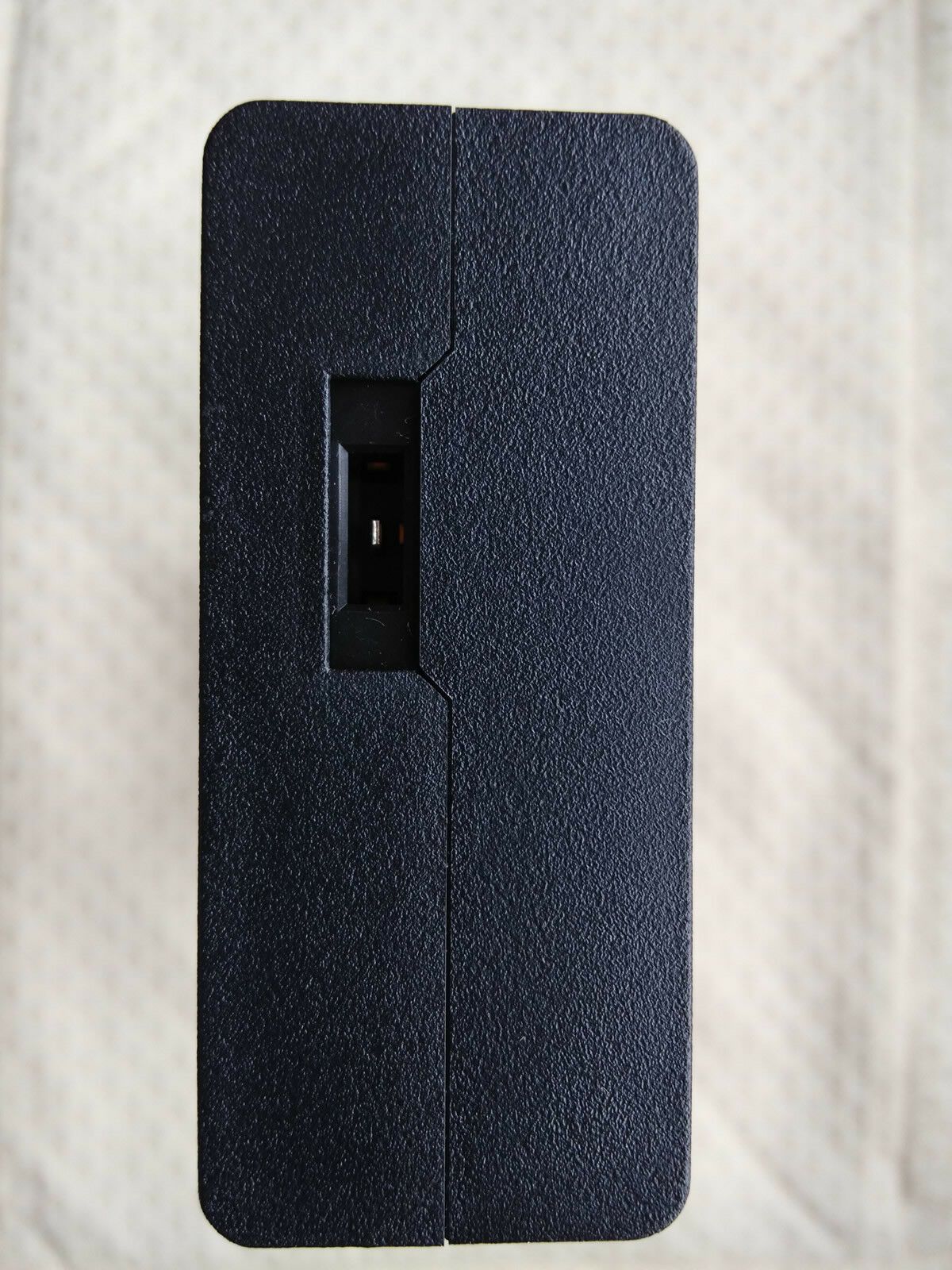 Close-up view of output port on Sony ACDP-240E01 adapter, 24V 9.4A DC output.